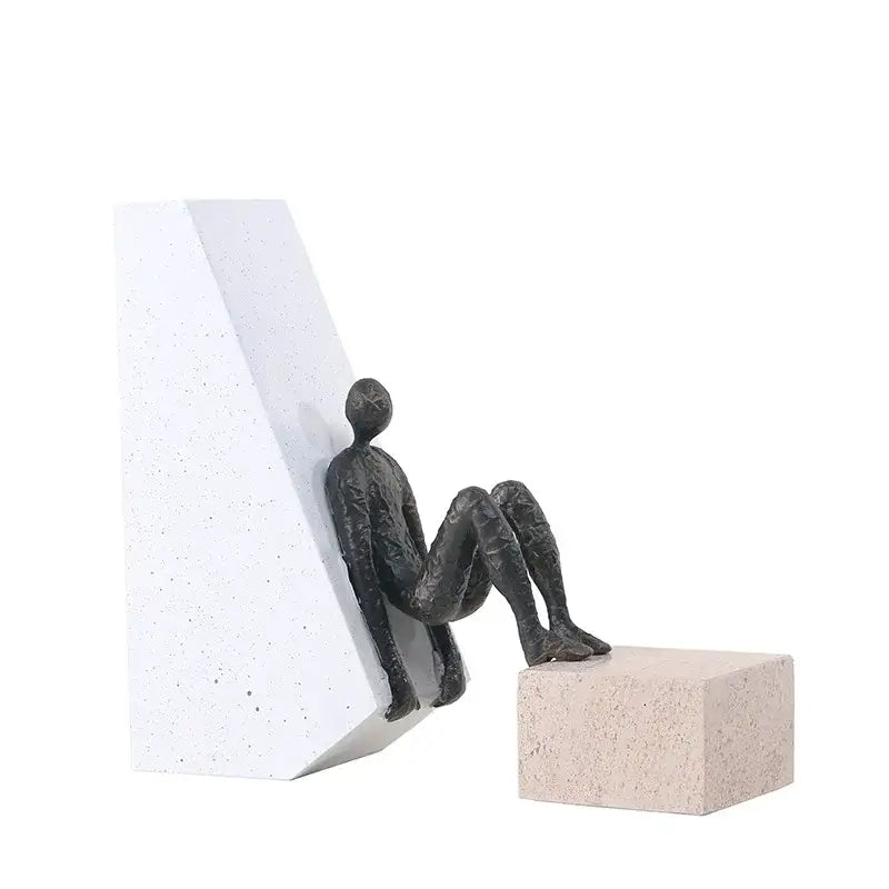 Abstract black and gold gymnast metal handicraft figure sitting against white textured bookend for living room decorbites gymnast metal decor