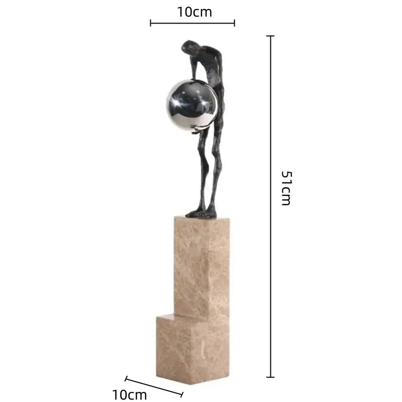 A sleek dark bronze gymnast metal handicraft figure holding a silver sphere on a beige marble pedestal for decorbites gymnast metal decor