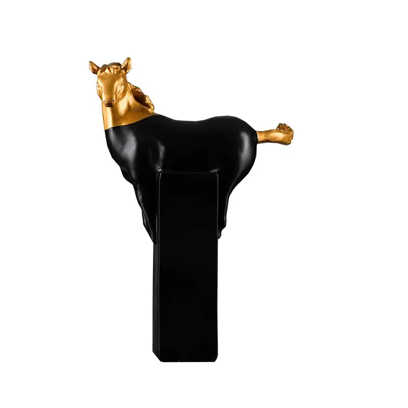 A sleek black and gold decorbites golden horse abstract sculpture with a glossy finish for living room decor