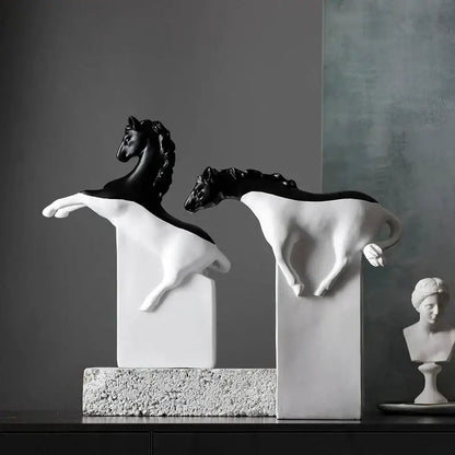 Two sleek black and white horse abstract sculptures on pedestals ideal for decorbites golden horse living room decor