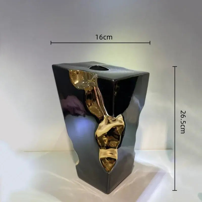 Black ceramic abstract vase with glossy finish and golden notch ceramic sculptural accents for living room decorbites decor
