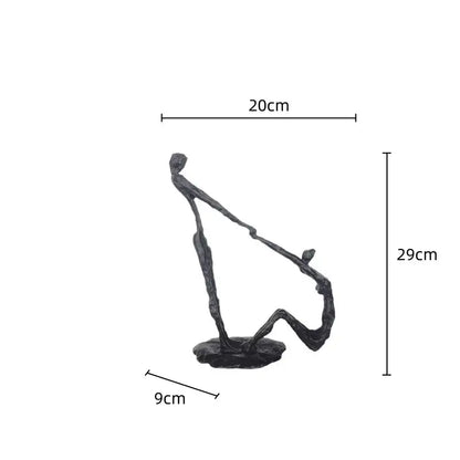 A sleek dark bronze hand dance sculpture of two intertwined figures in a dynamic pose for living room decor