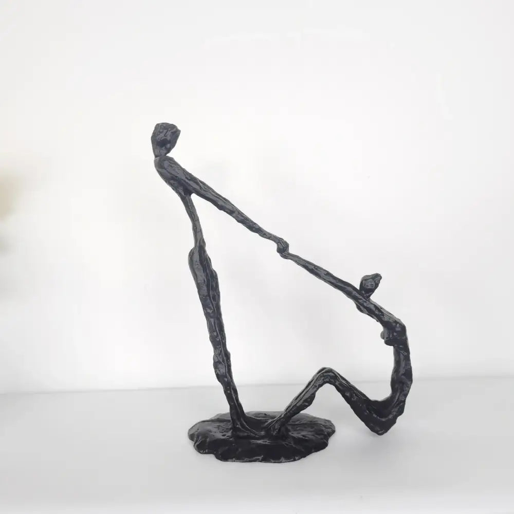 Black matte metal hand dance sculpture featuring two intertwined figures for living room adolescence decor