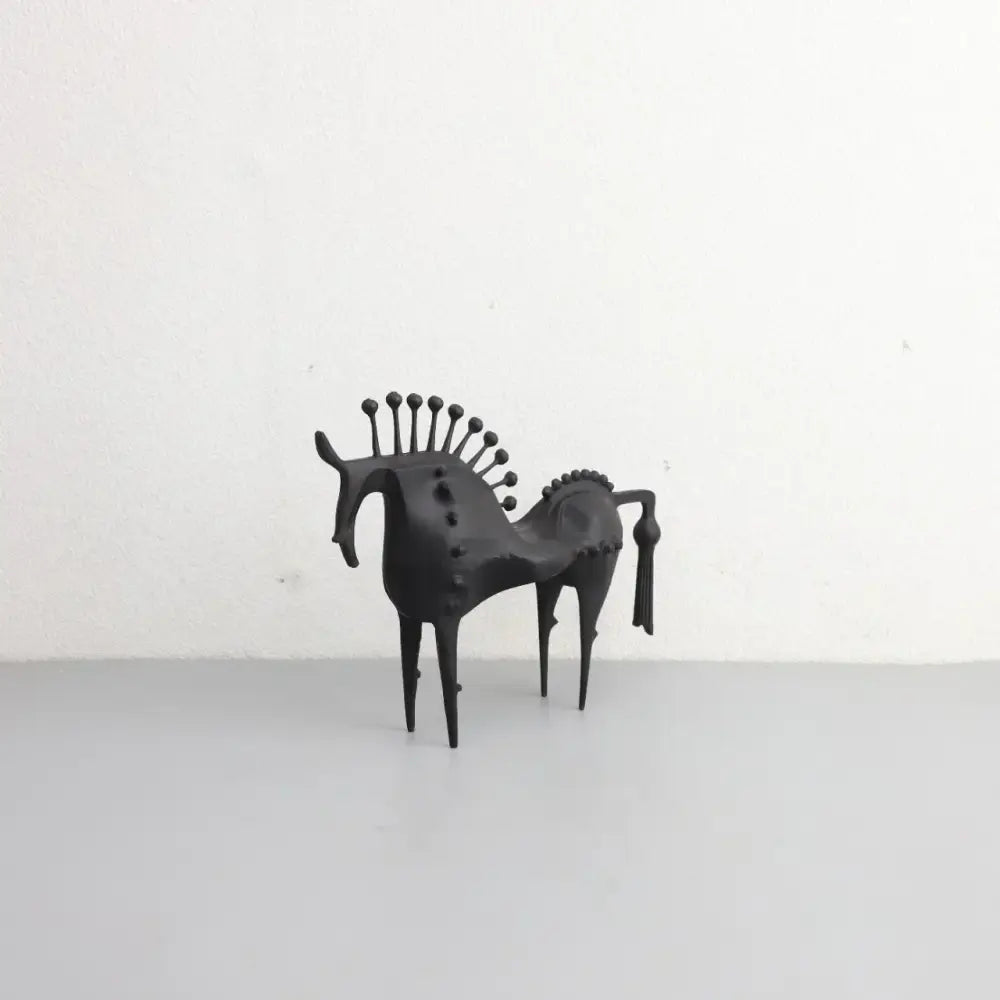 Black metallic metal sculpture horse figurine with spiky mane and studs for living room decorbites abstract horse decor