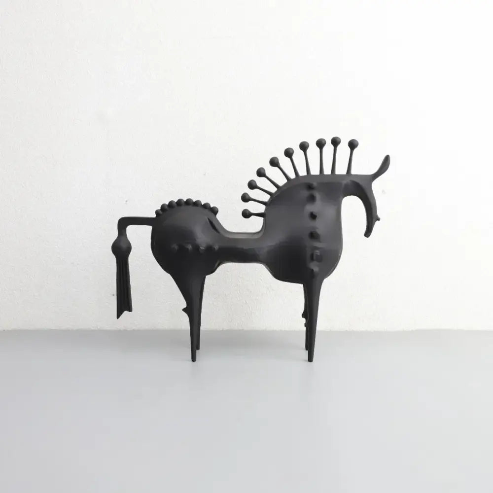 Black matte metal sculpture of a stylized horse with spiky mane and tail decorbites abstract horse decorative figurine