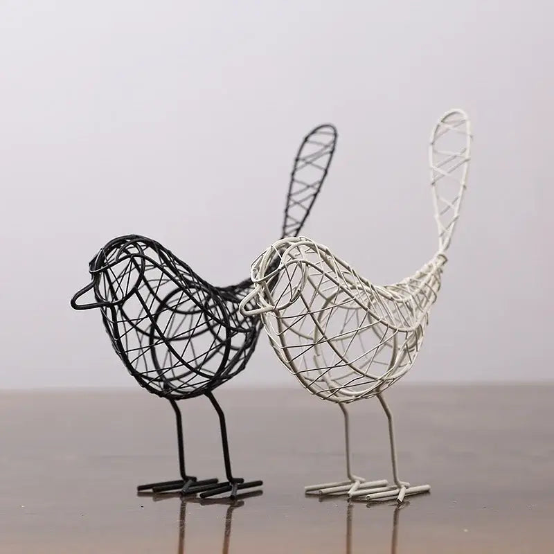 Two abstract black and white wire-woven iron bird figurines with intricate lattice design for living room decorbites iron bird decor