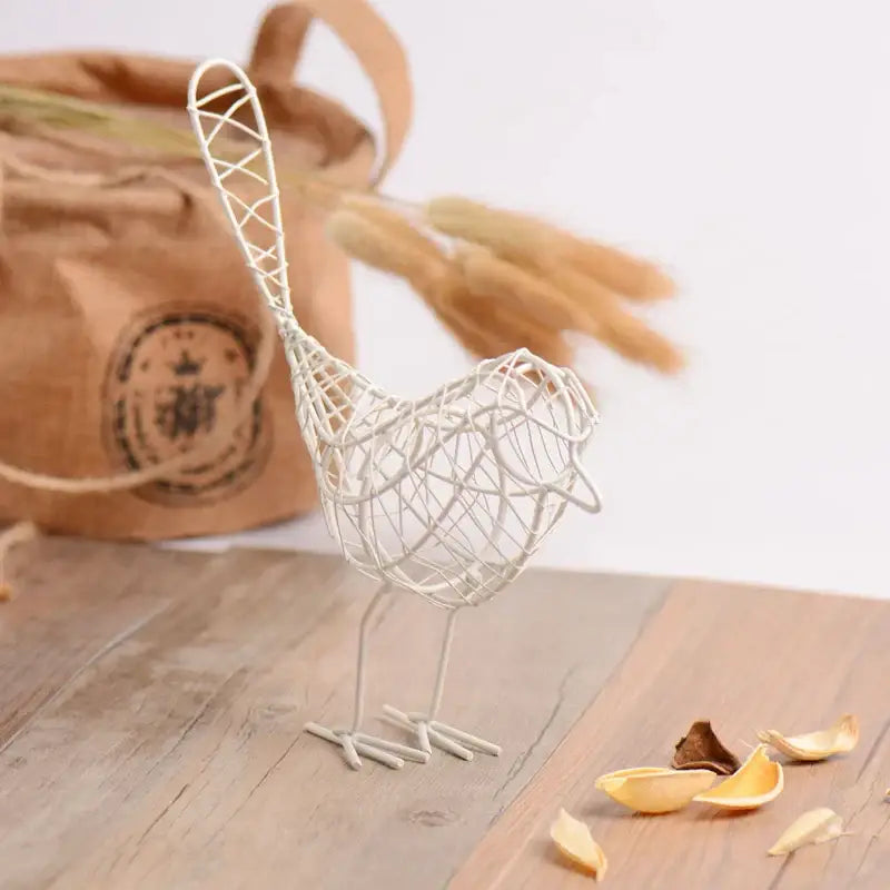 White wire iron bird figurine with intricate woven design and slender legs for decorbites iron bird decorbites living room decor