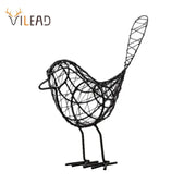 Abstract black iron bird figurines with intricate woven design and stylized tail for living room decor by decorbites iron bird