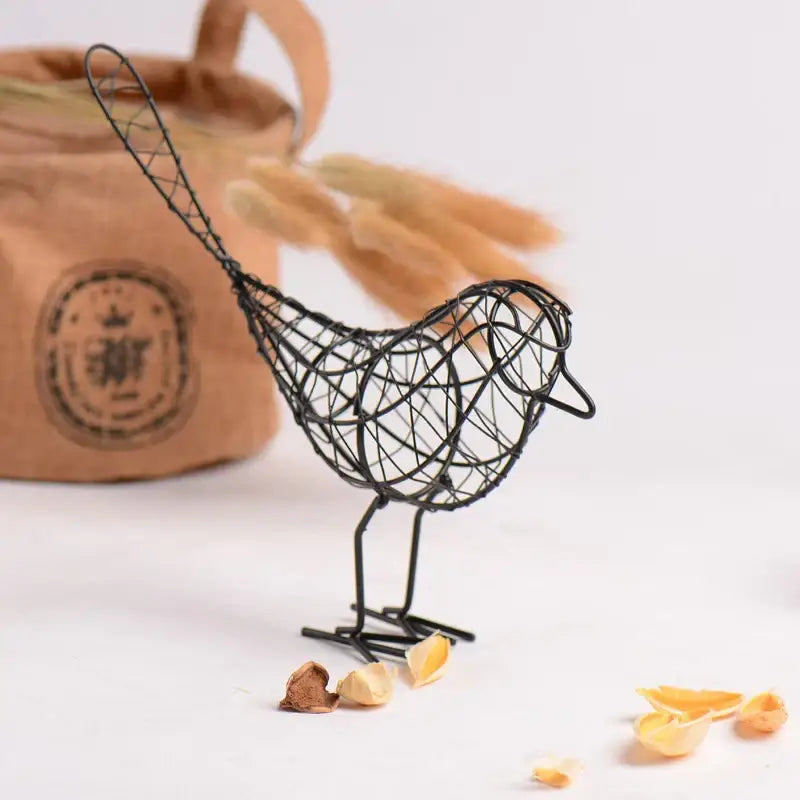 Abstract black iron bird figurines with intricate mesh detailing and slender legs for living room decorbites iron bird decor