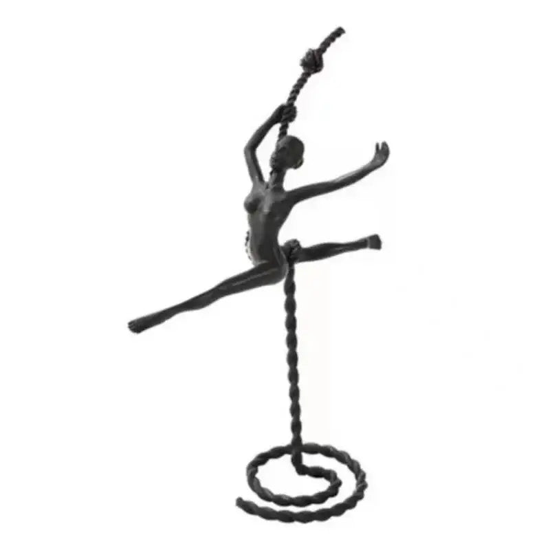 Black metal ballerina dancer sculpture in mid-leap suspended by twisted rope spiral base decorbites ballerina dancer decor