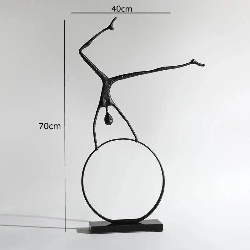 Abstract black metal sports figure sculpture in black metal balancing on a circular ring for decorbites living room decor