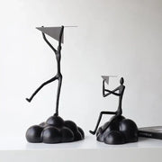 Black metal abstract figurines balancing resin paper airplane clouds for living room decor