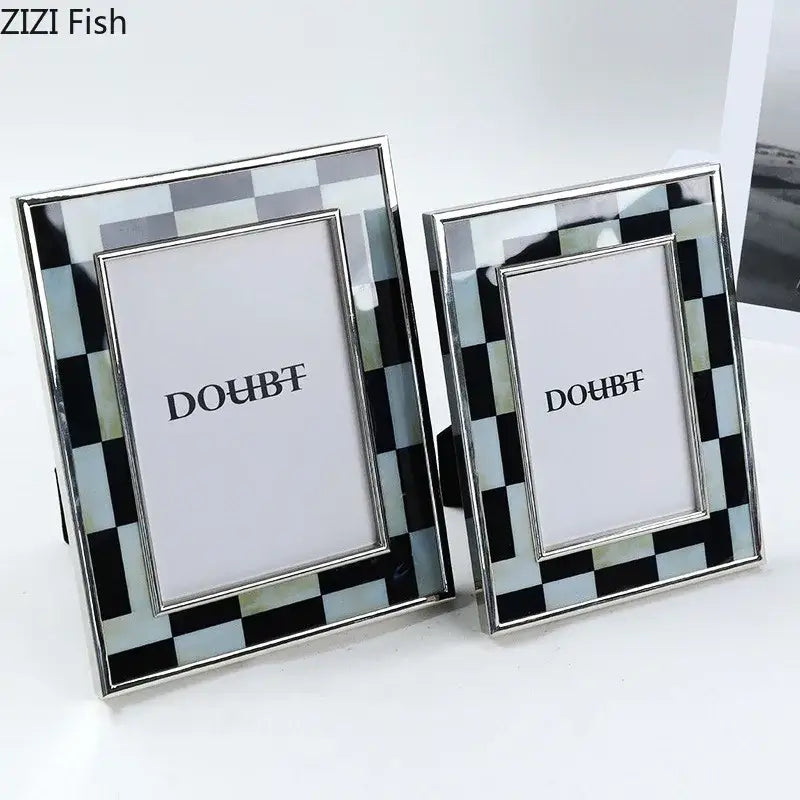 Two elegant black and silver checkered photo frames with a sleek metallic finish for bedroom desktop decorbites black white decor