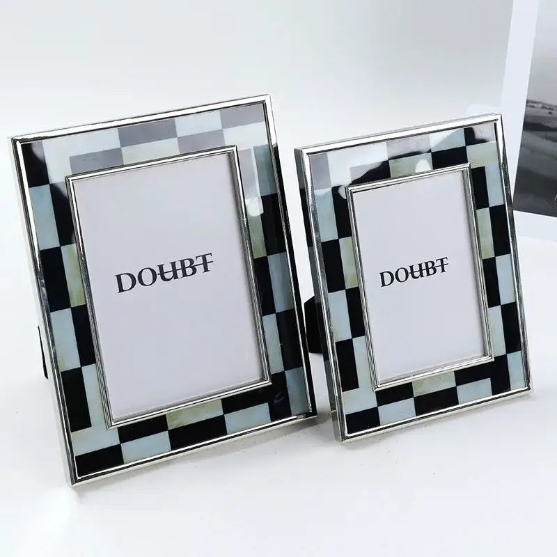 Silver-framed photo frame with black and light blue checkered inlay for bedroom desktop decor featuring decorbites black white design