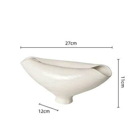 A sleek off-white ceramic bowl with a glossy finish and asymmetrical design for decorbites elliptic resin flower pot use
