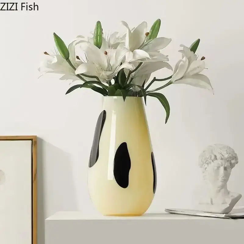 Cream-colored ceramic vase with bold black stripes abstract oval patterns for decorbites black stripes decor
