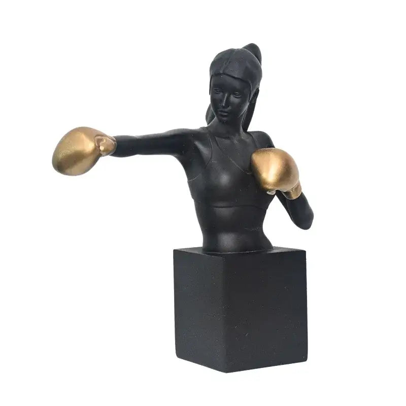Abstract black and white decorbites boxer resin statue featuring a female boxer in mid-punch with gold gloves for living room decor