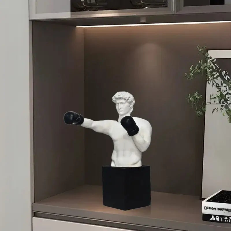 White marble-like decorbites boxer resin statue in boxing pose with black gloves on matte black cube base for living room decor