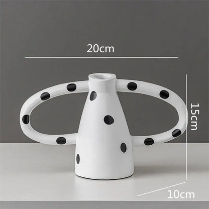 White ceramic decorbites ceramic vase with black white spots and two curved handles for living room decor