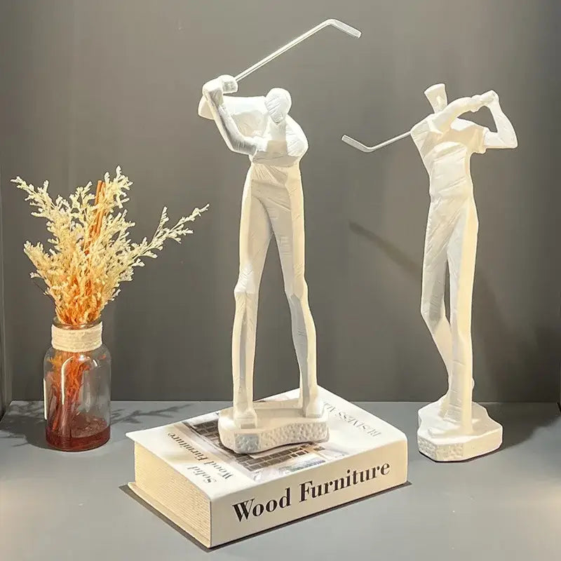 Two white resin golf player figurines in mid-swing and follow-through pose abstract black and white golf player sculpture decorbites
