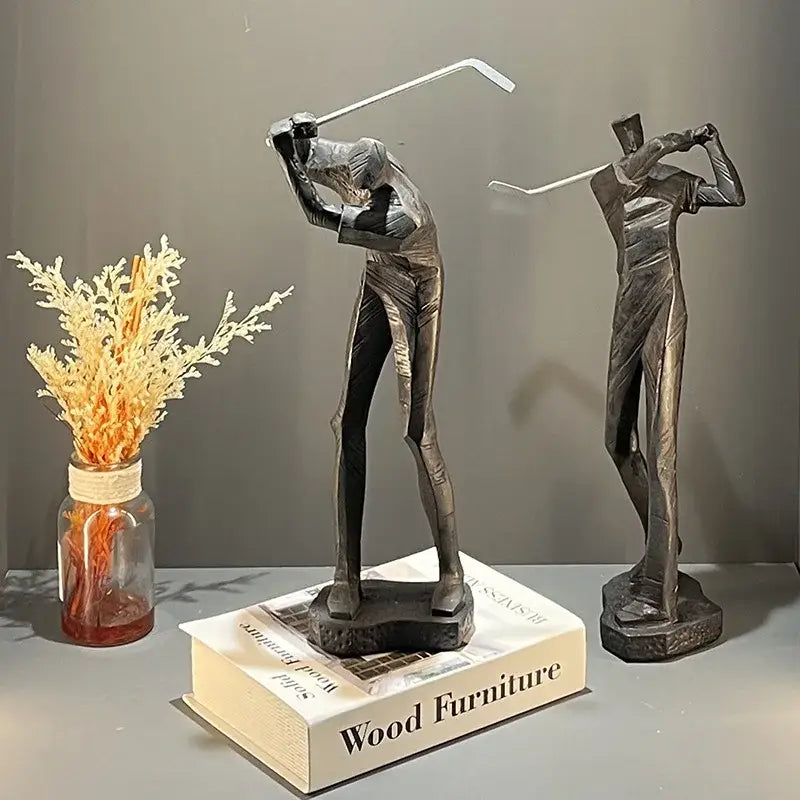 Two sleek metallic black and white golf player sculptures with minimalist human body figure design for decorbites golf player decor
