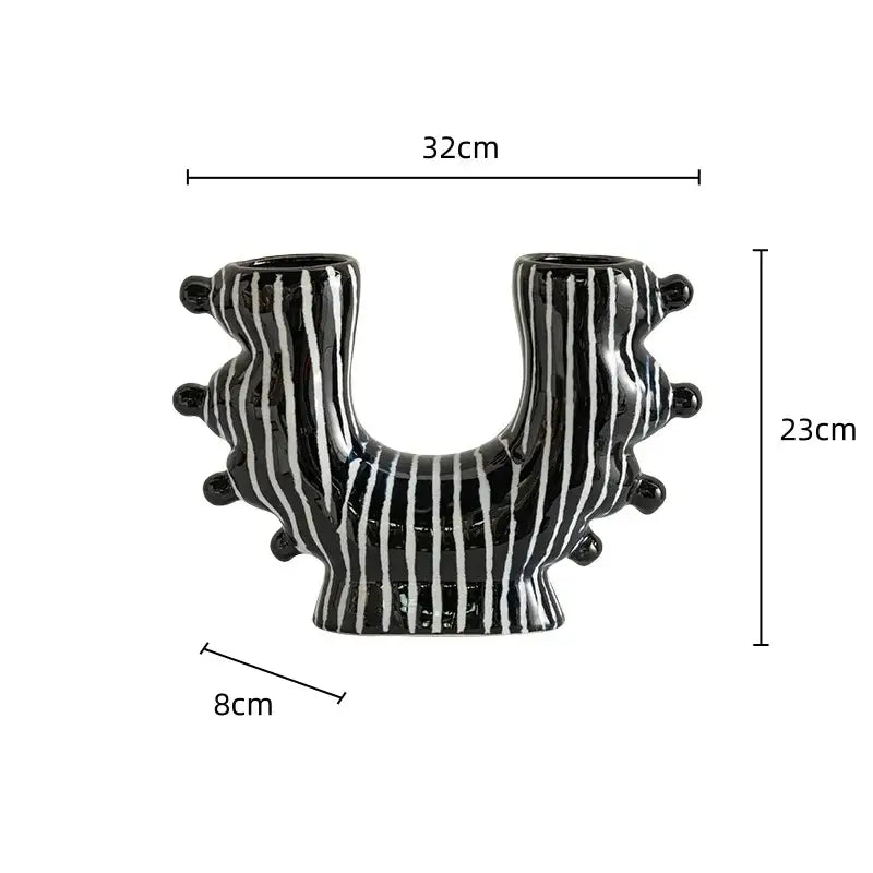 Black ceramic graffiti ceramic vase with white stripes and rounded protrusions for living room decorbites graffiti decor
