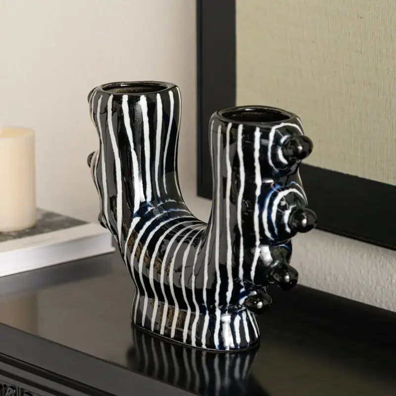 Abstract black and white decorbites graffiti ceramic vase shaped like a stylized dog for living room decor