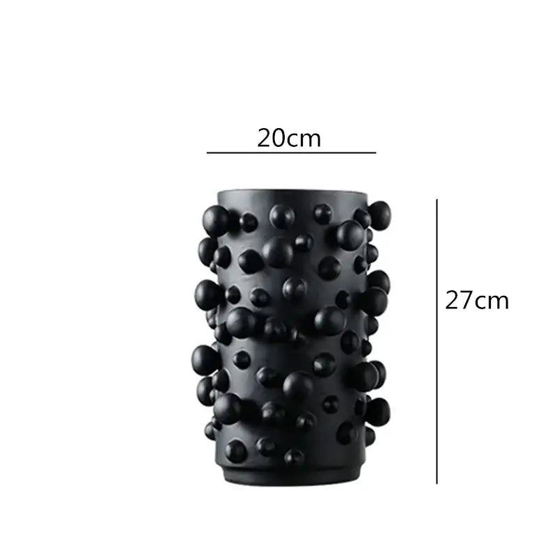 Black cylindrical resin vase with irregular bumps textured surface for decorbites black white abstract living room decor