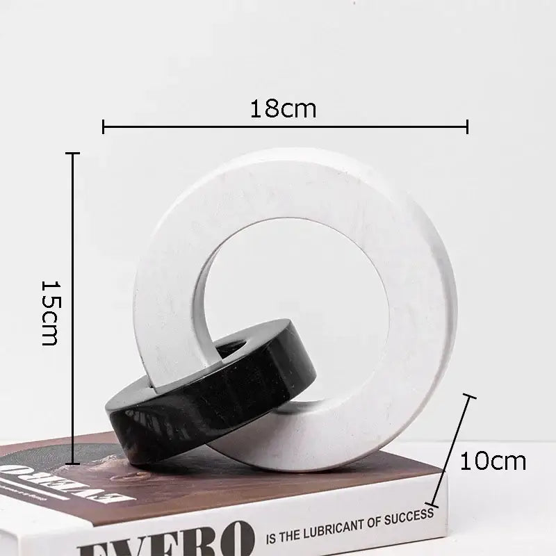 Abstract black and white marble round ring resin sculpture with minimalist modern design for living room decor