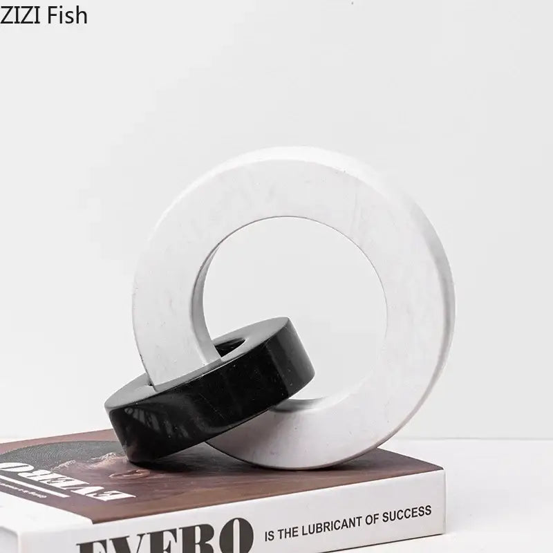 Abstract black and white marble round ring sculpture with sleek modern design for living room decor