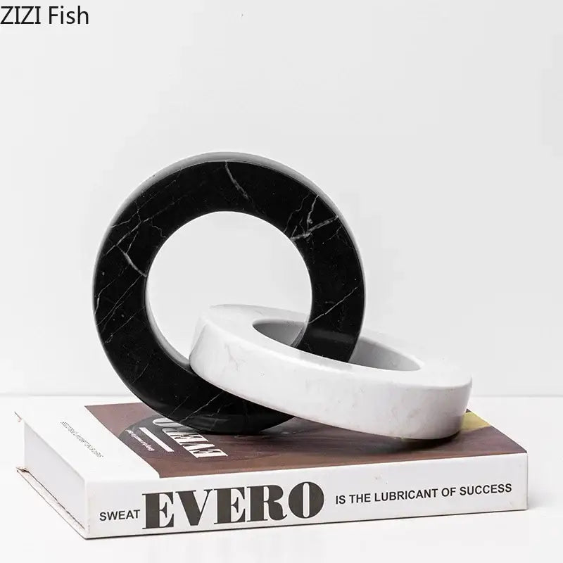 Abstract black and white marble round ring sculpture for living room decor featuring a smooth marble round design