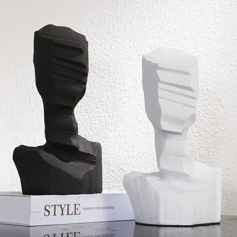 Abstract black and white resin decoration featuring geometric facial features for modern living room decor