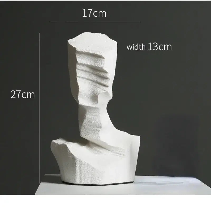 White abstract resin decoration sculpture with textured layered surfaces in modern minimalist geometric design