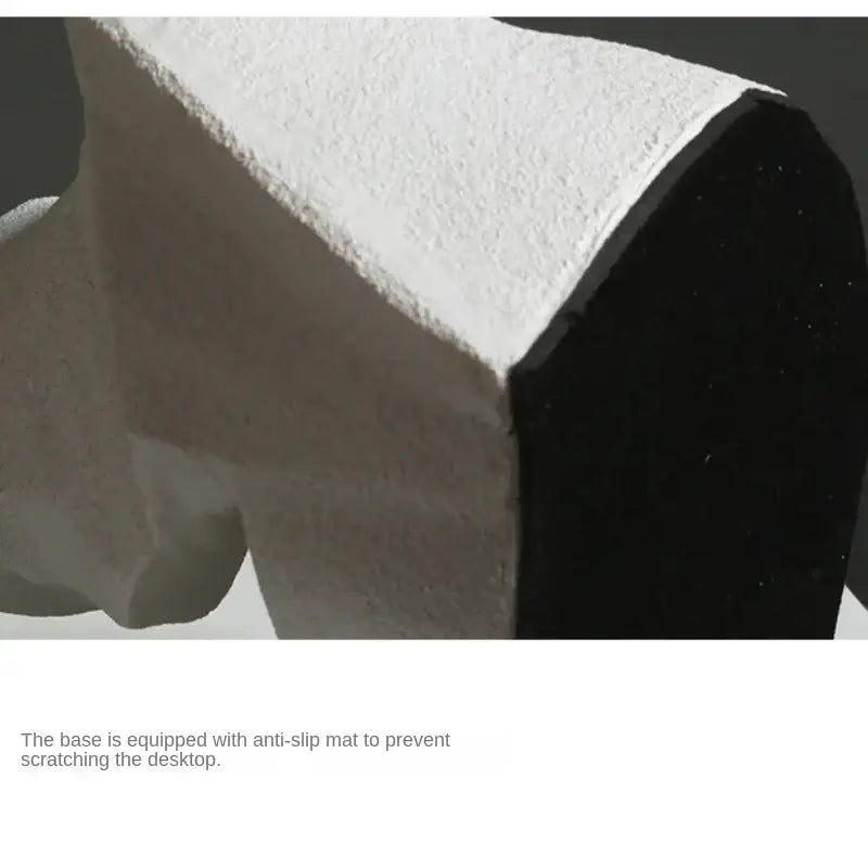 White and black textured desk organizer with matte finish as abstract resin decoration for modern living room use