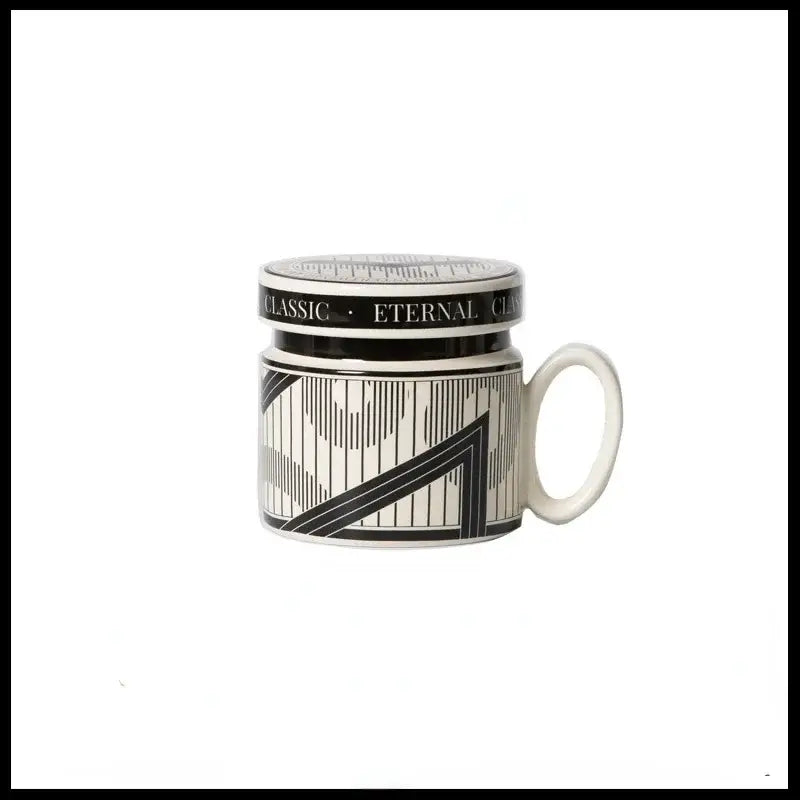 Black and white ceramic espresso cup with geometric art deco patterns and matching lid inscribed classic eternal for personalized french coffee gifts