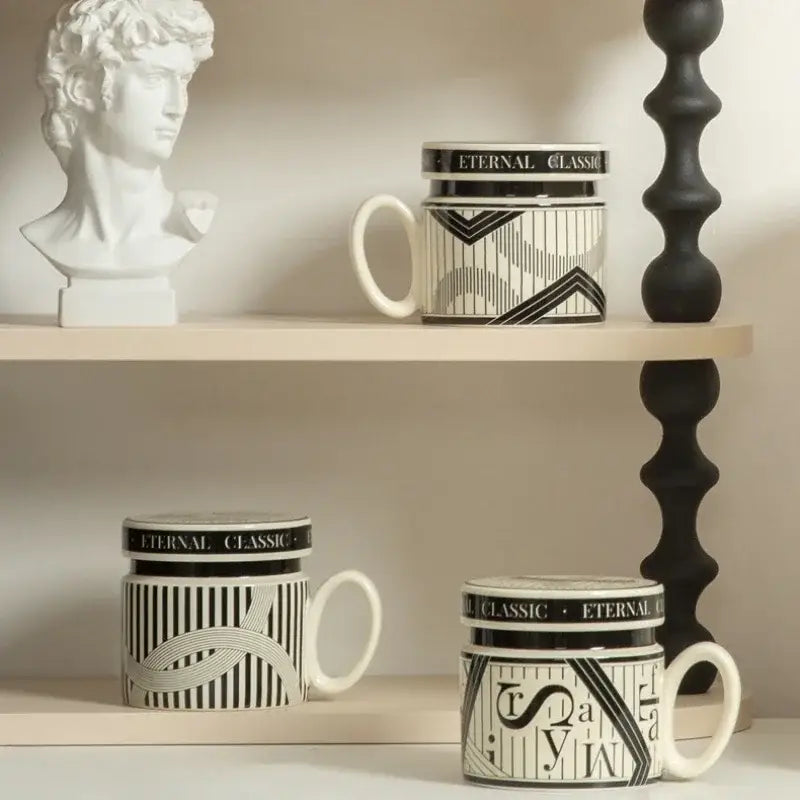 Black and white ceramic espresso cups with geometric patterns and eternal classic branding ideal for personalized french coffee gifts