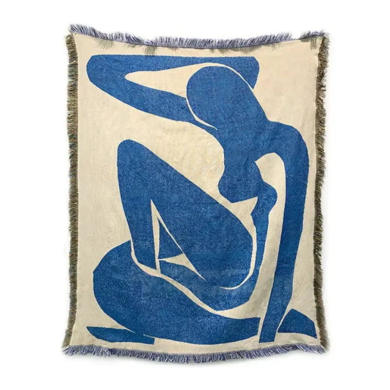 Beige throw blanket with bold blue abstract geometric knitted tassels and fringed edges ideal for bedroom use