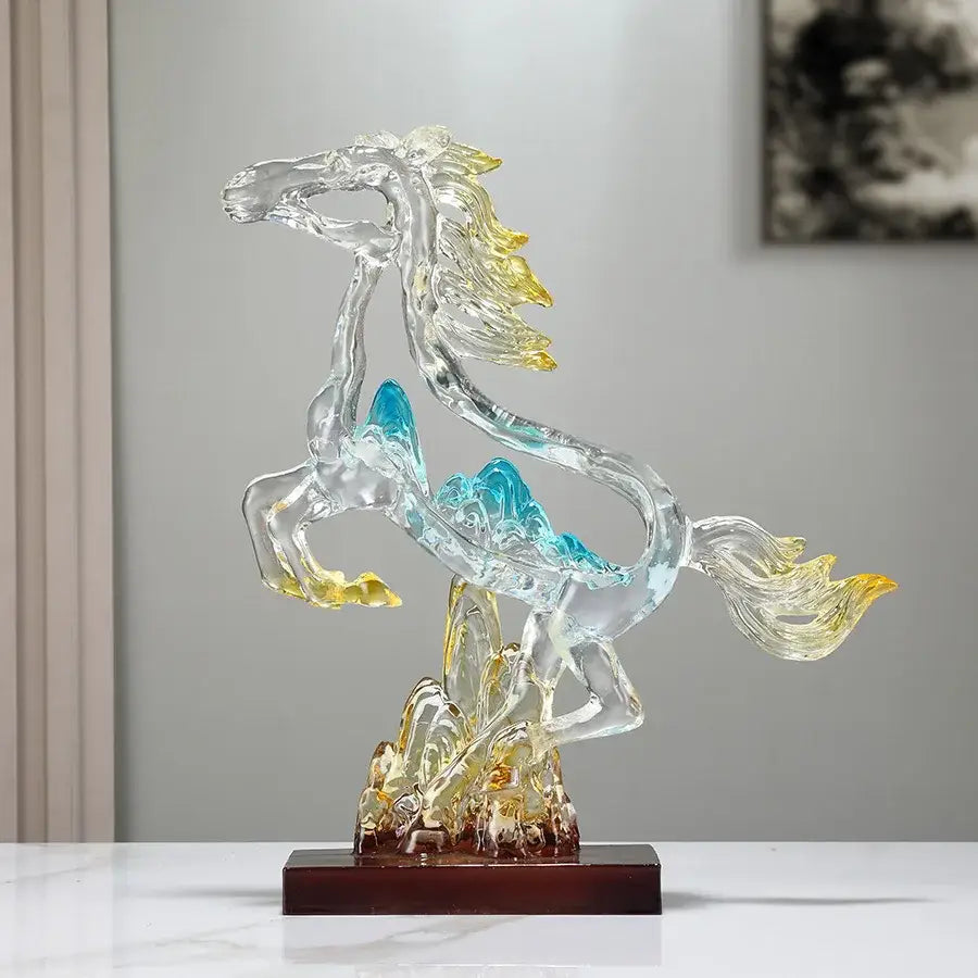 Translucent decorbites crystal horse statue with flowing blue and gold accents on dark wooden base for living room decor