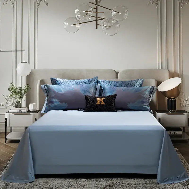 Light blue satin bed sheet with subtle sheen draped over mattress in abstract blue gray 1500tc jacquard egyptian cotton bedding set
