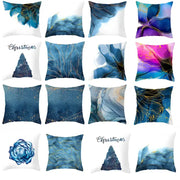 Set of twelve decorative cushion covers with abstract blue ink and gold edge marbled designs for living room use