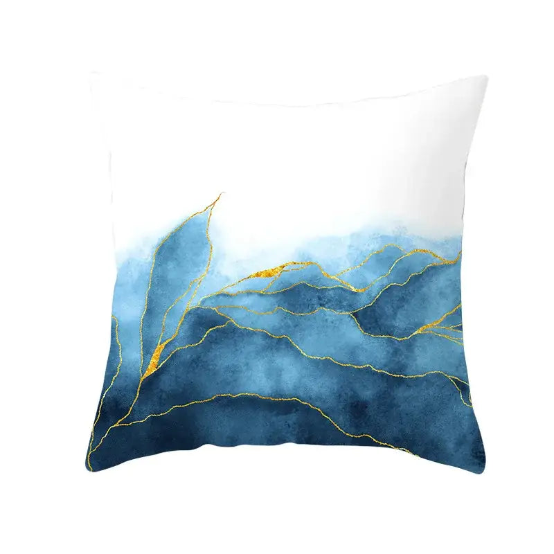 A square cushion cover with abstract blue ink mountain design and gold edge details for living room decor