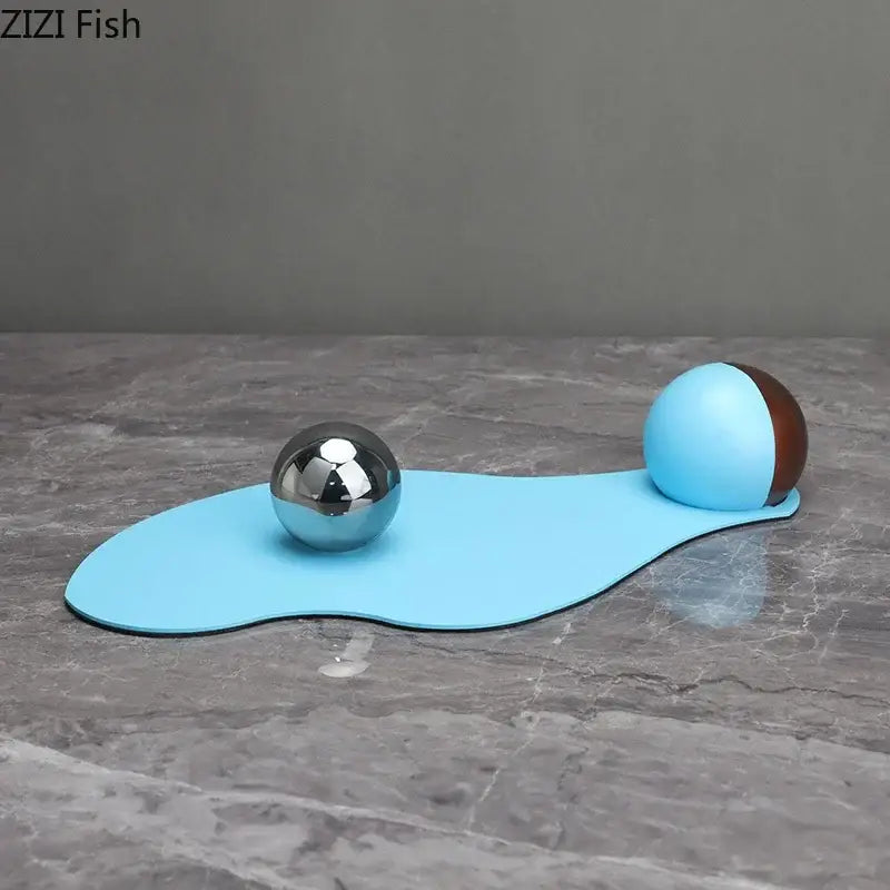 Abstract blue liquid ornaments desk sculpture with light blue and brown silicone ball mat and reflective silver sphere
