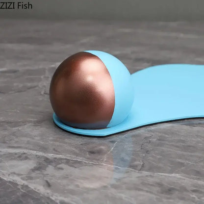 A sleek two-toned silicone stress ball with copper and matte blue halves resembling blue liquid ornaments for decor