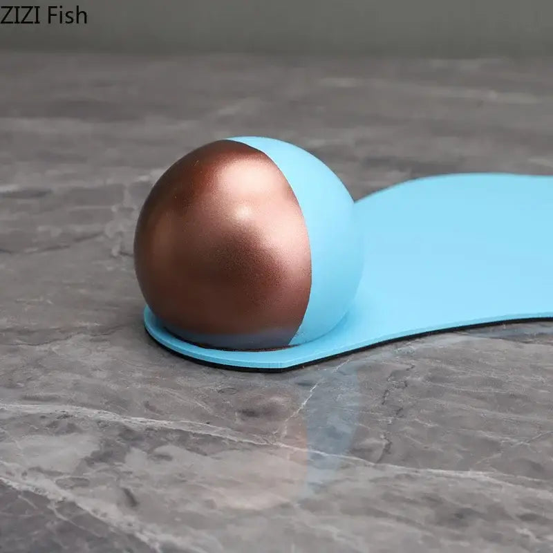 A sleek two-toned silicone stress ball with copper and matte blue halves resembling blue liquid ornaments for decor