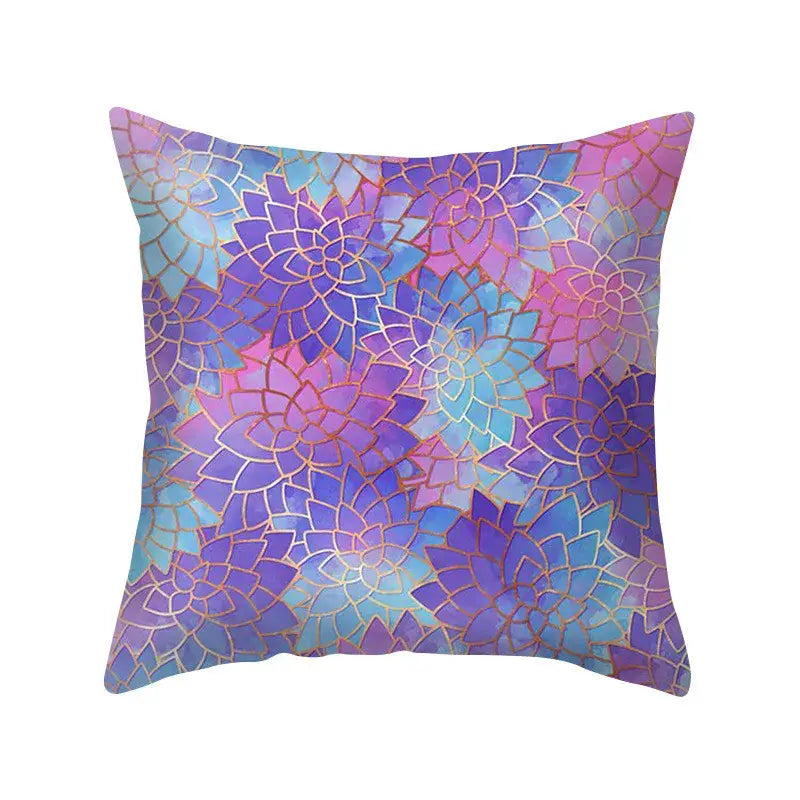 A square pillow case with a vibrant blue purple polyester floral pattern and gold outlines for bedroom decorbites