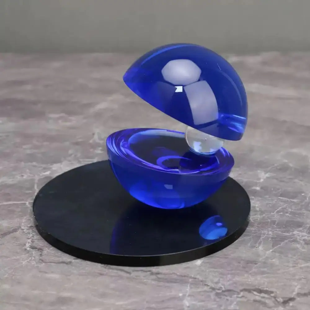 Abstract blue and silver semi-circle ornaments featuring a translucent blue glass orb with an inner clear sphere for home decor by decorbites crystal glass