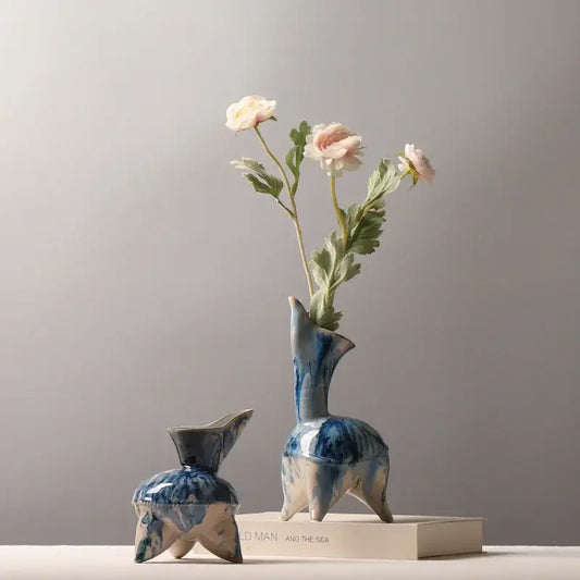 Blue and white ceramic vase with irregular ink pattern and abstract animal design for living room decor