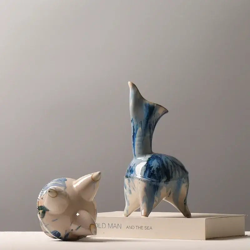 Blue and white ceramic figurine of a standing deer with abstract irregular ink pattern for living room decor