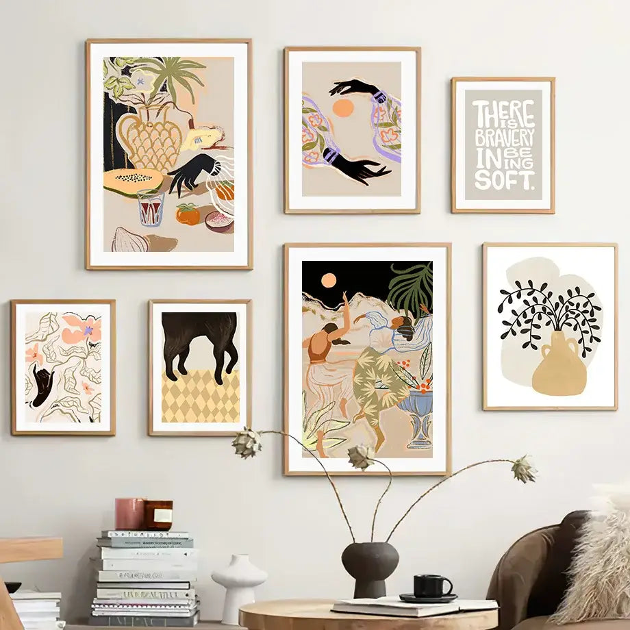 Set of six framed wall art prints featuring abstract girl hand and botanical designs in light wood frames for living room decor
