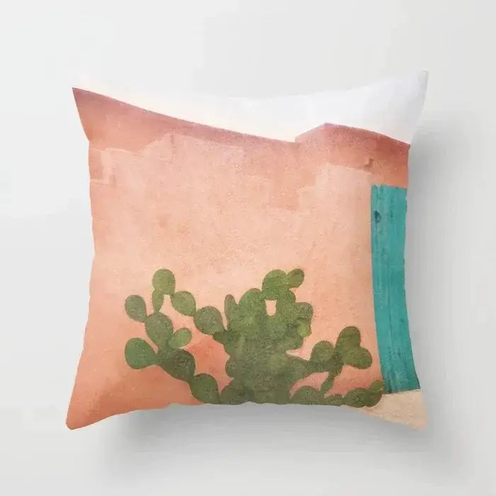 A square decorbites decorative pillowcase with a textured peach wall, green cactus, and teal door design for living room decor